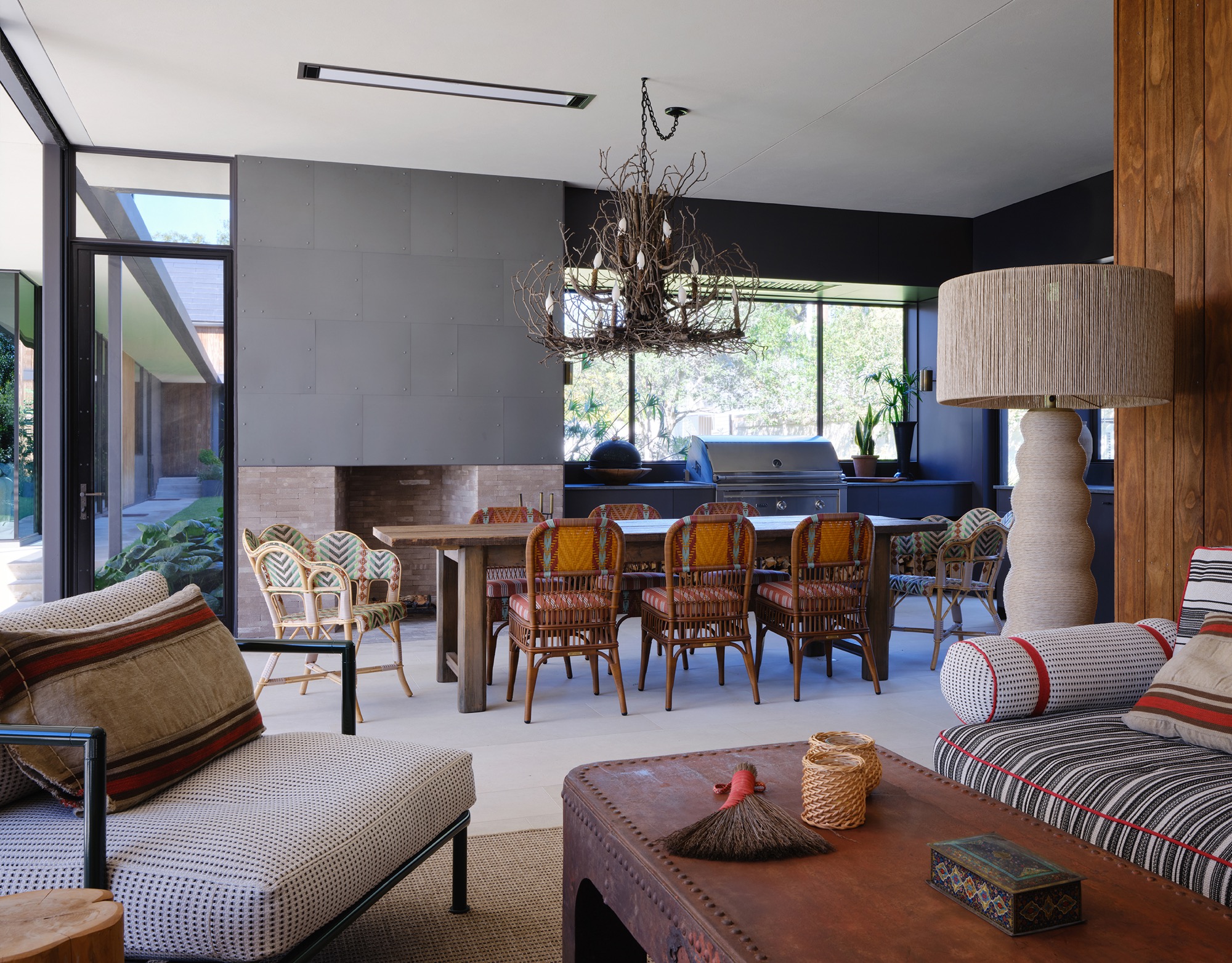 Victorian House screened porch with fireplace and outdoor kitchen in Austin, Texas